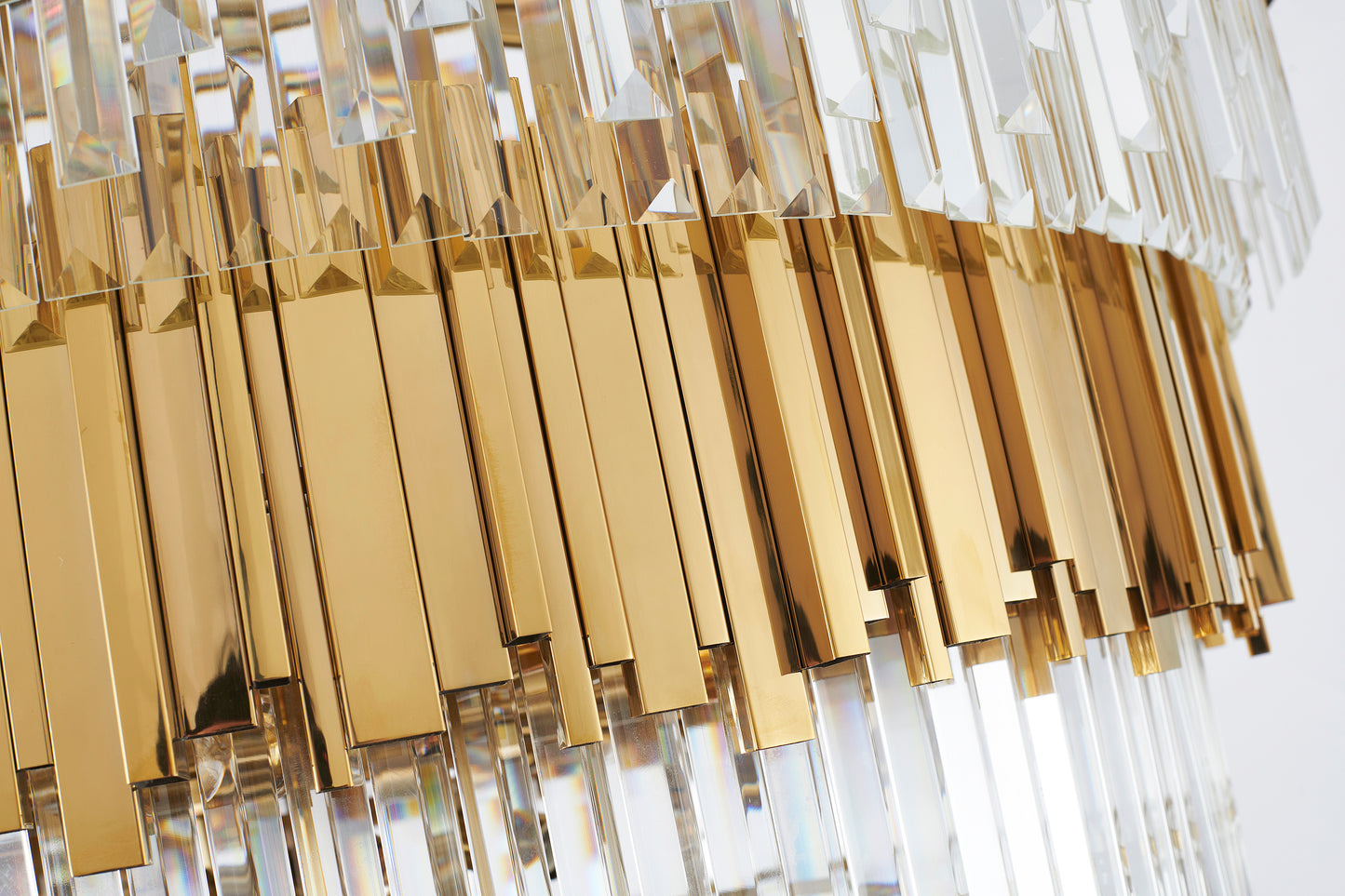 Side view of the 63-inch Golden Cascading chandelier highlighting its elongated silhouette, lights off.