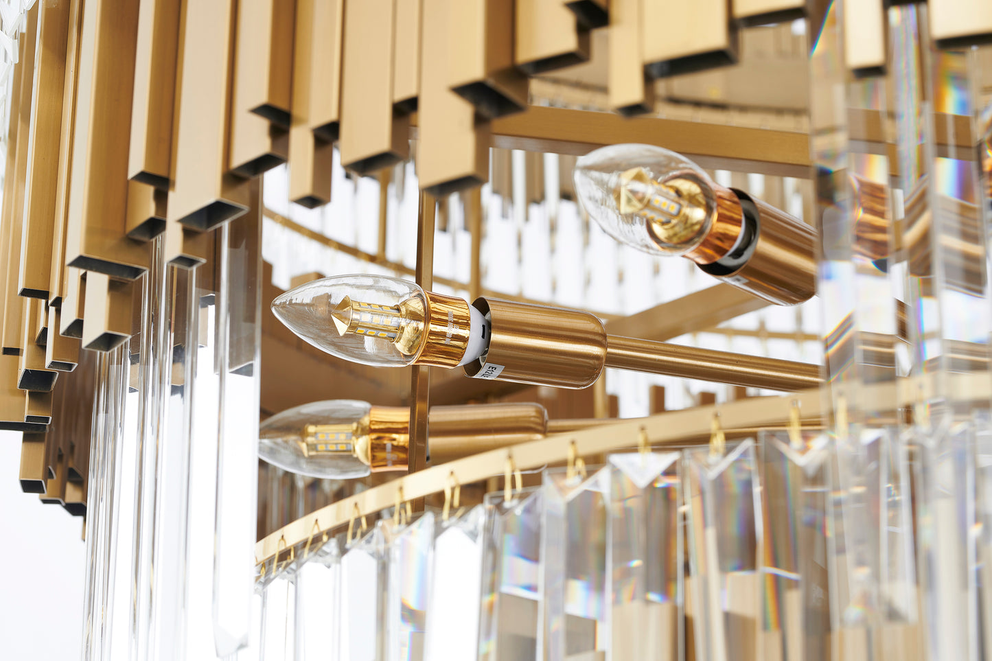 Looking up into the internal brass framework of the 78-inch chandelier, showing the radial support spokes and bulb sockets.