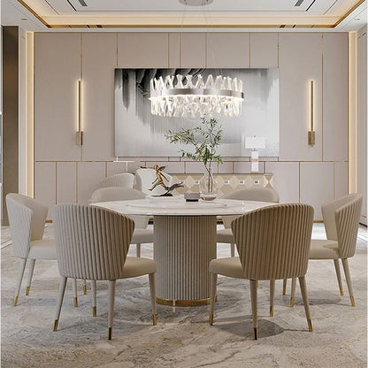 26-inch Chrome Ring Cut crystal chandelier suspended over a modern round dining table with fluted chairs.