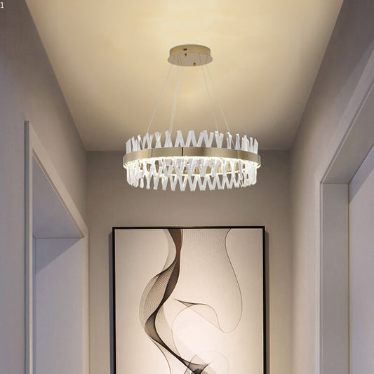 32-inch Golden Ring Cut crystal chandelier installed in a minimalist hallway, casting a warm glow over a modern art piece.