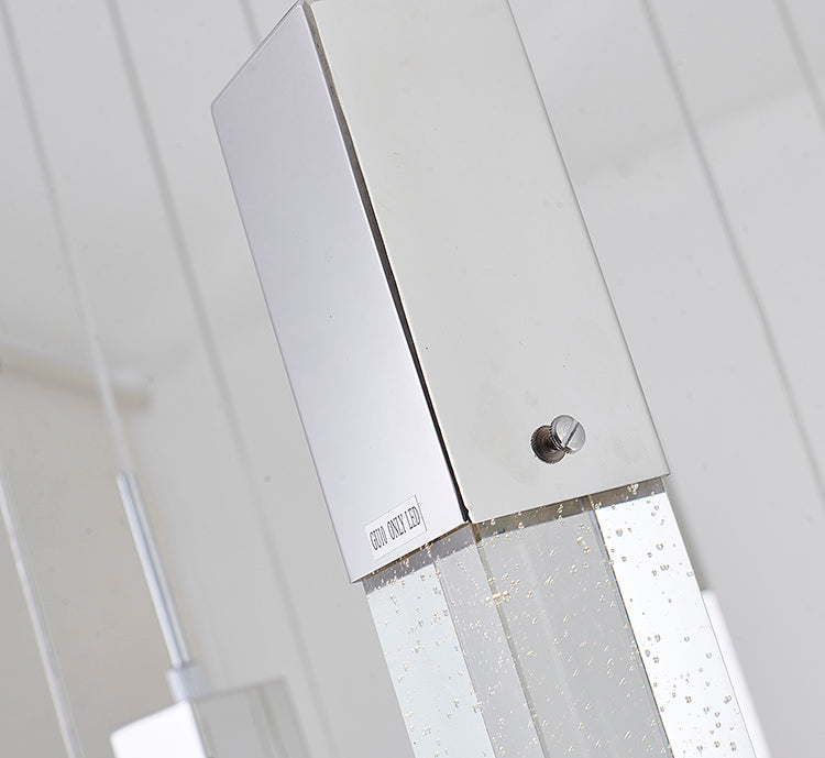 Close-up of the chrome mounting hardware and the top of the crystal cylinders, showing the high-quality reflective finish.