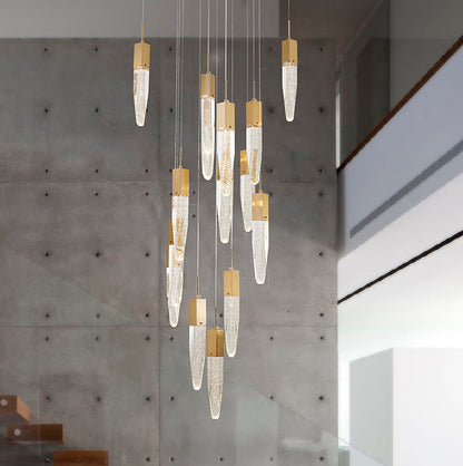 The Golden Iceberg Bubble Crystal Chandelier suspended against a grey concrete feature wall in a modern, high-ceilinged transition space.