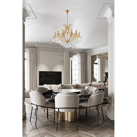 31-inch 2-tier antique brass crystal chandelier suspended in a sophisticated dining room with neutral upholstered chairs.