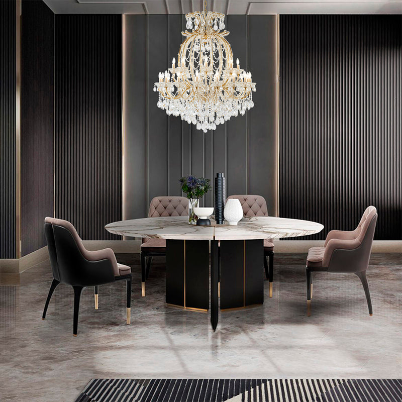 Grand 50-inch 3-tier satin brass crystal chandelier installed in a modern luxury dining room over a marble table.