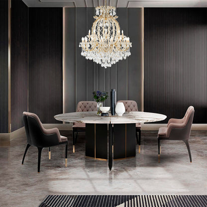 Grand 50-inch 3-tier satin brass crystal chandelier installed in a modern luxury dining room over a marble table.
