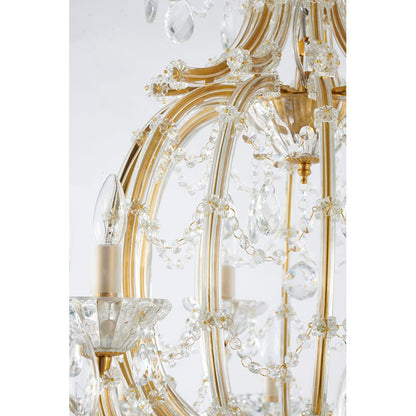 Detailed view of the crystal bead garlands draped between the satin brass arms, showing high-clarity crystal.