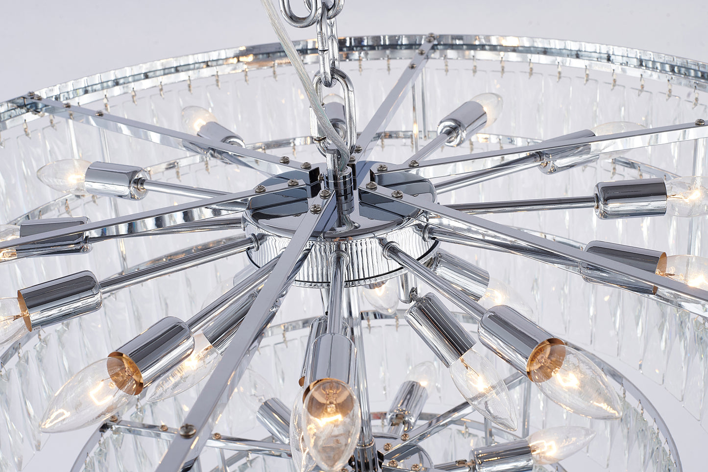Close-up of lights on faceted crystal accents on the Chrome Waterfall 8-tiered chandelier.